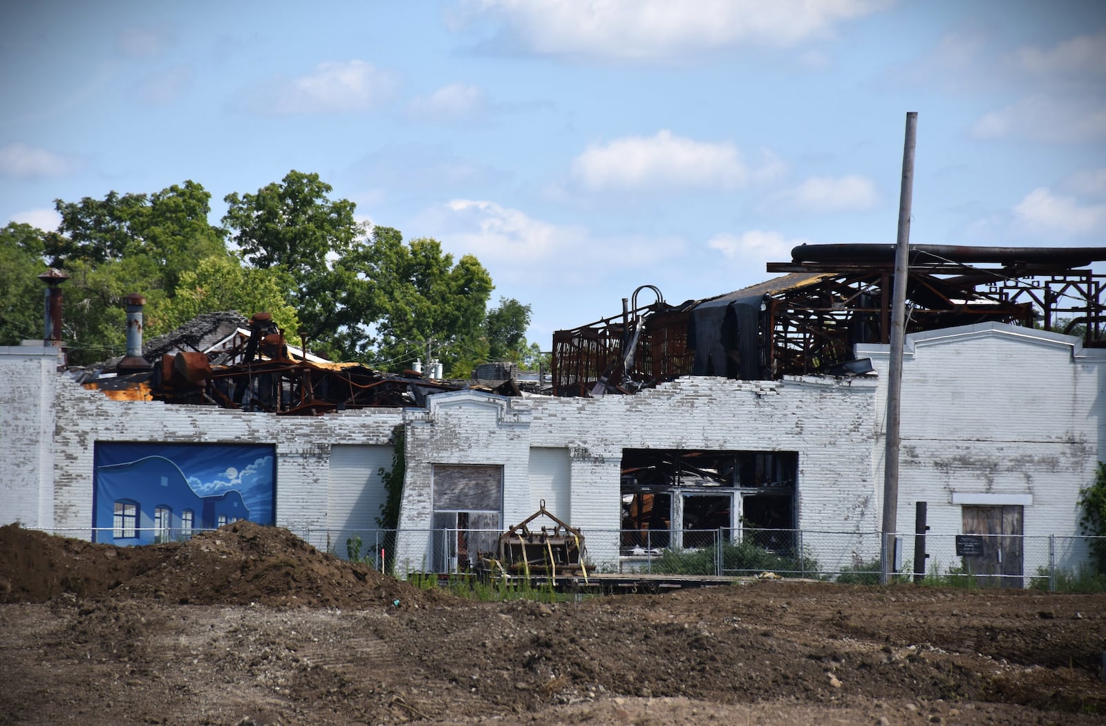 Officials with the National Aviation Heritage Area and the Dayton Aviation Heritage National Historical Park say the top part of the facade of building 1 on the Wright Co. factory site in West Dayton has caved in. They believe this likely happened in July 2025. CORNELIUS FROLIK / STAFF