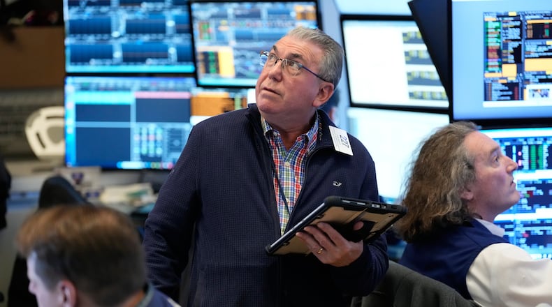 John Bishop works on the floor at the New York Stock Exchange in New York, Wednesday, March 4, 2026. (AP Photo/Seth Wenig)