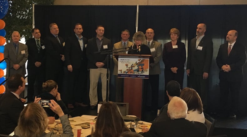 Eleven of the 16 Montgomery County school superintendents attended the annual kindergarten readiness summit Friday, March 2, 2018. From left are Centerville’s Tom Henderson, Northmont’s Tony Thomas, New Lebanon’s Greg Williams, Vandalia-Butler’s Rob O’Leary, Mad River’s Chad Wyen, Brookville’s Tim Hopkins, Huber Heights’ Sue Gunnell (at mic), Miamisburg’s David Vail, Dayton’s Elizabeth Lolli, Oakwood’s Kyle Ramey and Northridge’s Dave Jackson. JEREMY P. KELLEY / STAFF