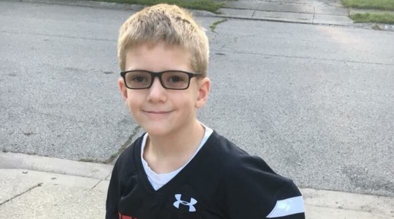 Cub Scout Collin Schaefer lead and effort that collected nearly 6,000 handmade Christmas cards for children being treated at Dayton Children’s Hospital.