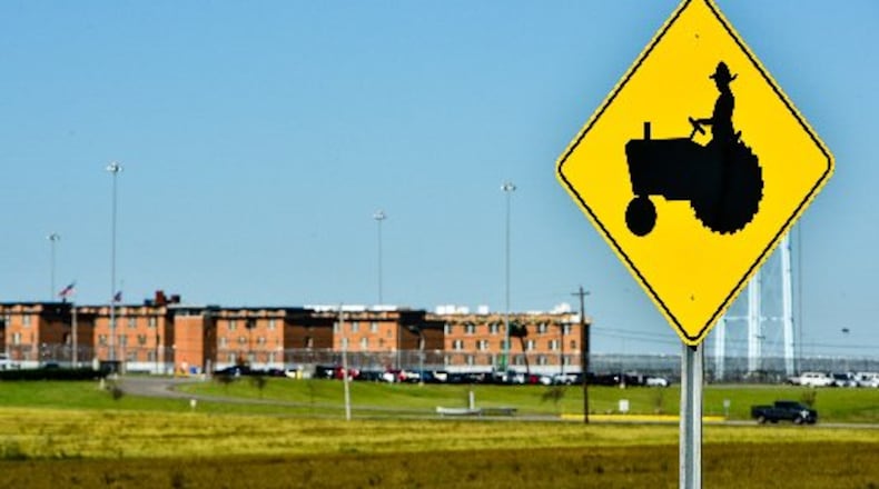 A former prison worker pleads guilty and the second of three defendants is sentenced for smuggling drugs into Lebanon Correctional Institution, in background, which led to an inmate's 2023 overdose death. STAFF