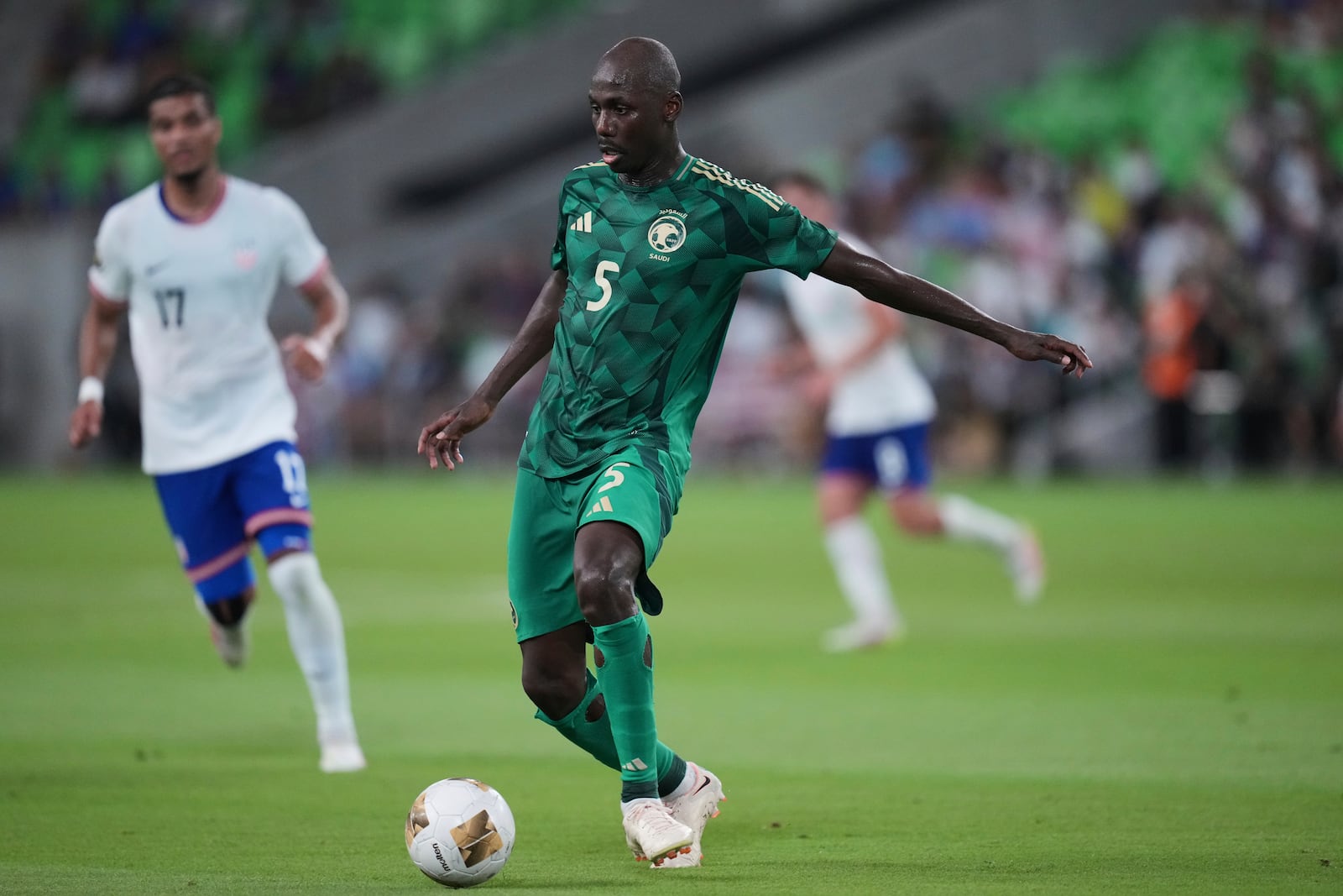 Saudi Arabia's Firas Alburaikan (9) works the ball against the United States during a CONCACAF Gold Cup soccer match, Thursday, June 19, 2025, in Austin, Texas. (AP Photo/Eric Gay)