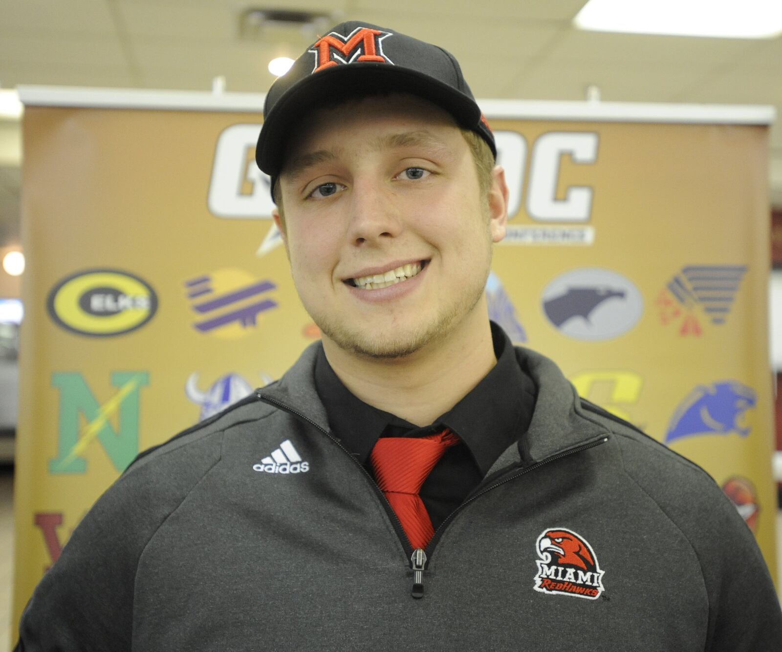 Jordan Rigg of Springboro H.S. is headed to Miami University to play football. He joined other area seniors who signed to play football at the Greater Western Ohio Conference signing ceremony at the Huber Heights Athletic Foundation Center on Friday, Feb. 7, 2014. MARC PENDLETON / STAFF
