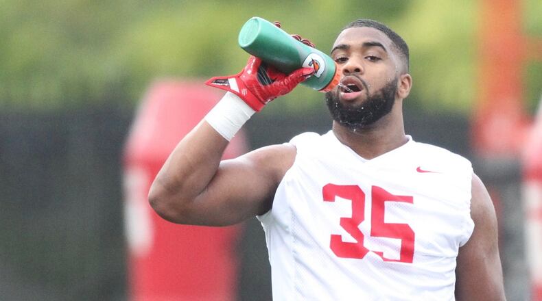 Ohio State’s Chris Worley gets a drink during practice on Thursday, July 27, 2017, at the Woody Hayes Athletic Center in Columbus. David Jablonski/Staff