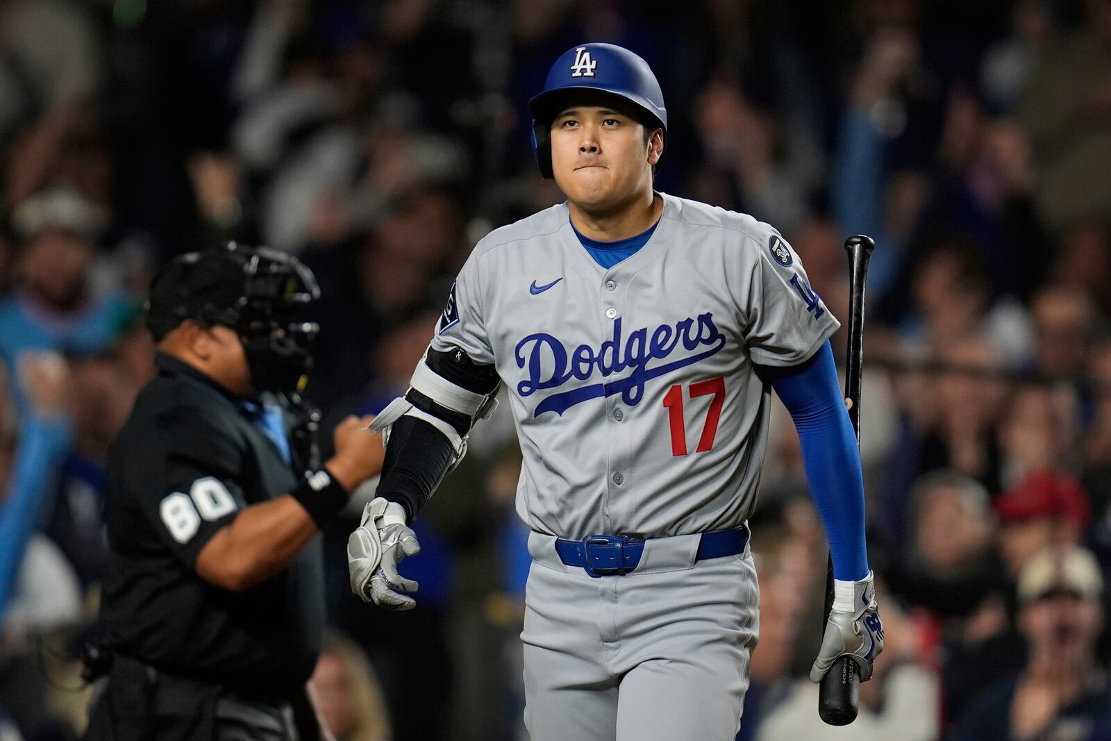 Los Angeles Dodgers designated hitter Shohei Ohtani (17) returns to the dugout after striking out during the ninth inning of a baseball game against the Chicago Cubs, Wednesday, April 23, 2025, in Chicago. (AP Photo/Erin Hooley)