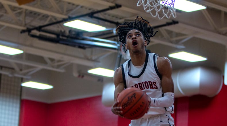 Wayne's Lawrent Rice scores on his way to a school-record 46 points in Friday night's victory over Miamisburg. CONTRIBUTED/Jeff Gilbert