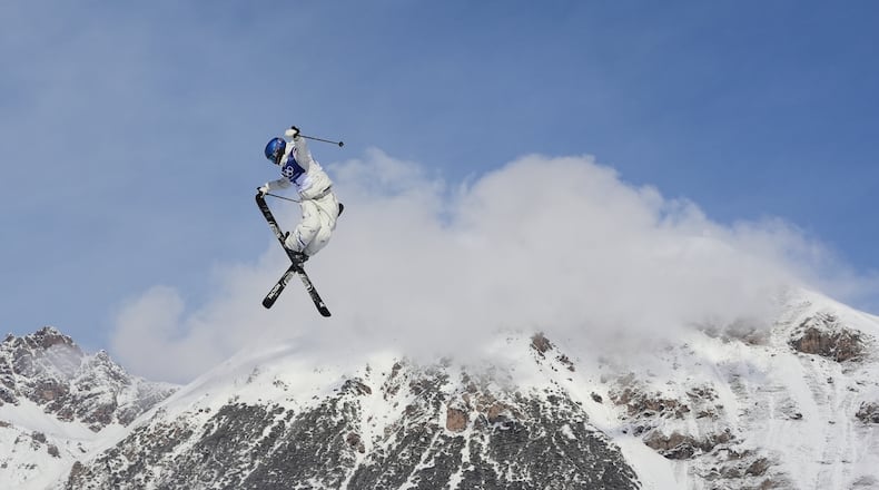 FILE - China's Eileen Gu practices during a freestyle skiing slopestyle training session at the 2026 Winter Olympics, in Livigno, Italy, Feb. 5, 2026. (AP Photo/Lindsey Wasson, File)