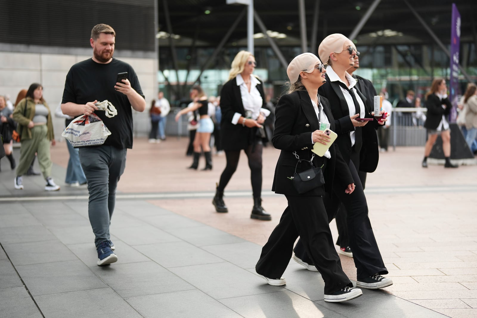 Fans exit North Greenwich Station prior to a performance by Pitbull on Monday, June 9, 2025, in London. (Photo by Scott A Garfitt/Invision/AP)