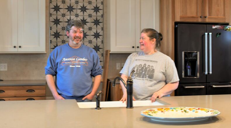 Jerry and Kristin Webster talk about the kitchen in their new home in an 1902 brick structure first built as a school and then used for decades for a meeting place of Old Order German Baptists. CONTRIBUTED