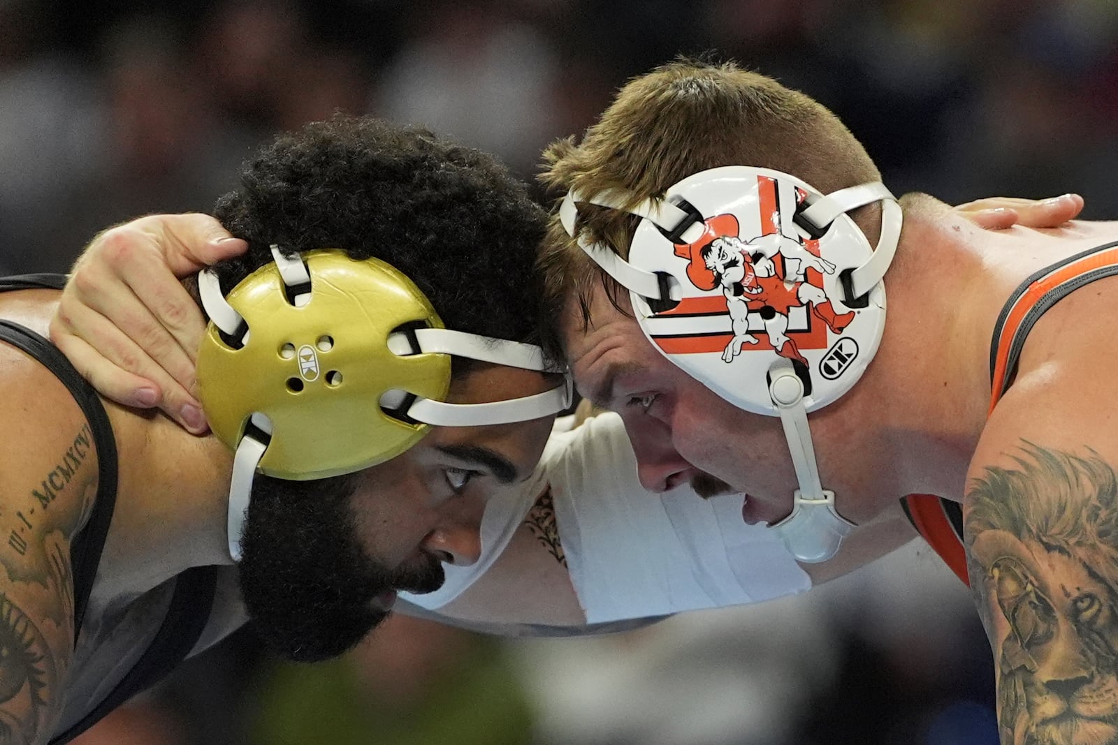 FILE - Oklahoma State's Wyatt Hendrickson, right, takes on Minnesota's Gable Steveson during a 285-pound match in the finals at the NCAA wrestling championship, March 22, 2025, in Philadelphia. (AP Photo/Matt Rourke, file)
