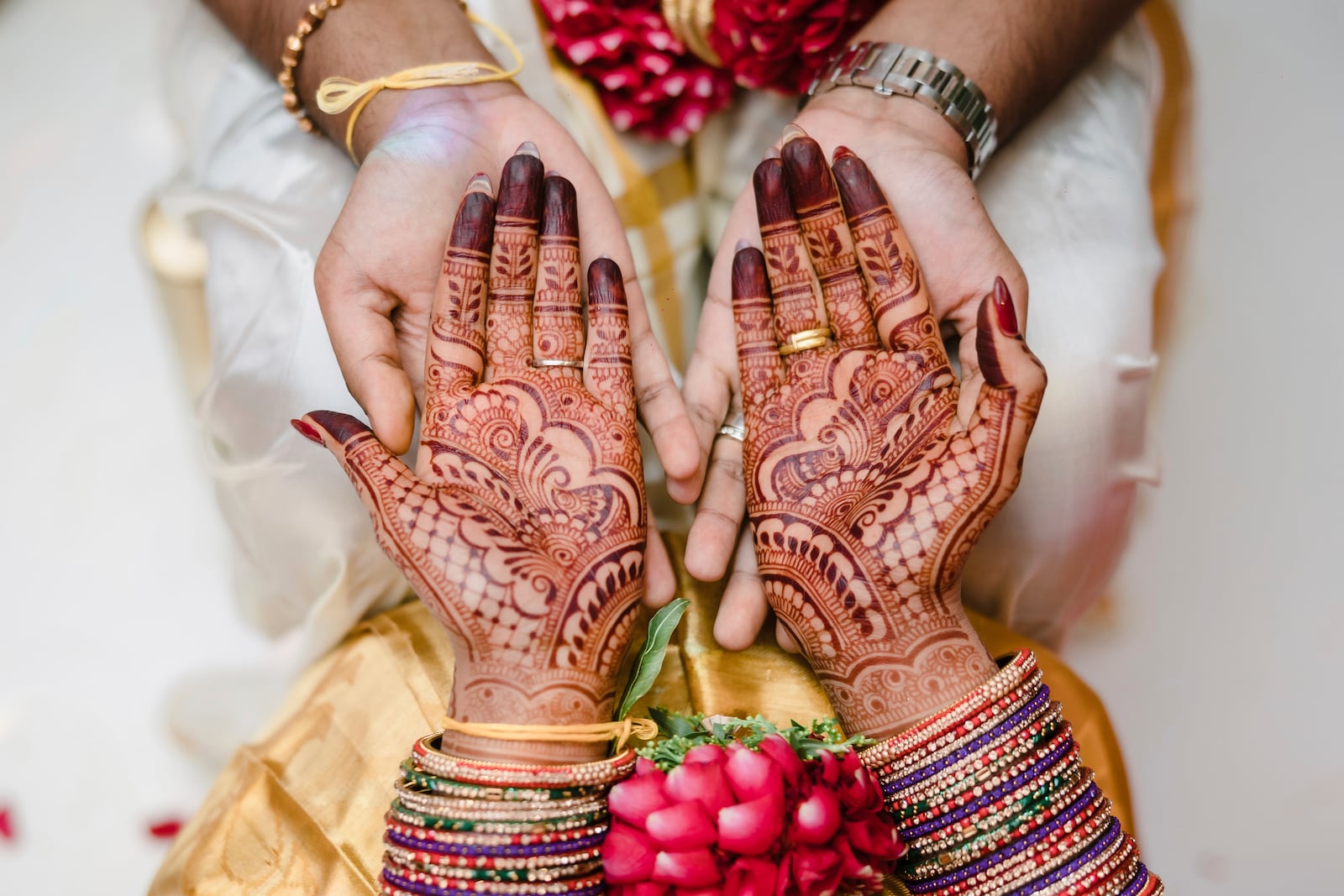 This May 2023 photo shows a bride's hands covered in mehndi in Addison Park, N.J. (Alexander Mai of Omne Amor via AP)