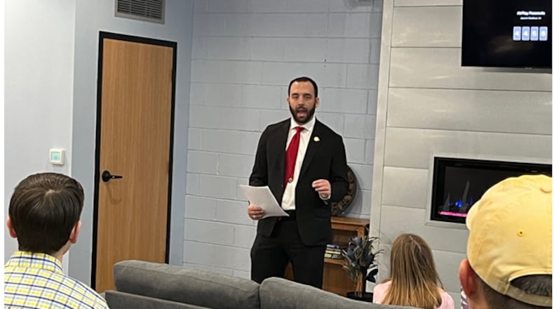 State Rep. Adam Mathews, R-Lebanon, explains his proposed bill to eliminate Ohio's state individual income tax over the next six years during a town hall in Mason on Tuesday, Jan. 23, 2024. The audience of about a dozen people were receptive to the idea but expressed some skepticism on the lack of concrete details. ED RICHTER/STAFF