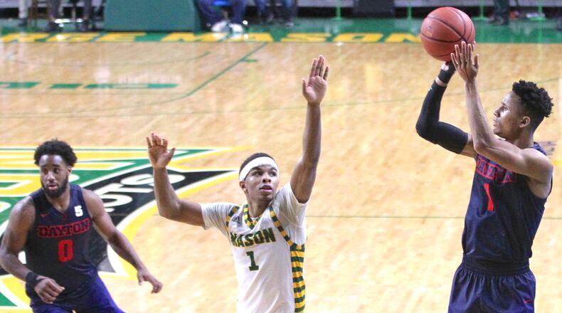 Dayton’s Darrell Davis shoots over George Mason’s Justin Kier on Wednesday, Feb. 14, 2018, at EagleBank Arena in Fairfax, Va. David Jablonski/Staff