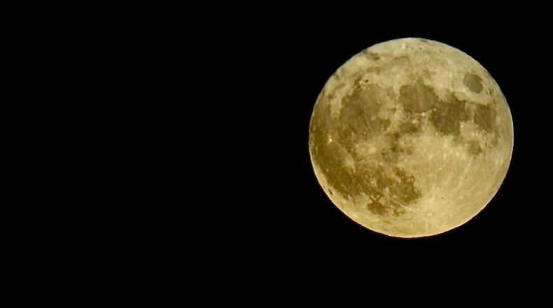 The full moon Thursday night, Aug. 11, 2022, is known as the sturgeon moon. MARSHALL GORBY/STAFF