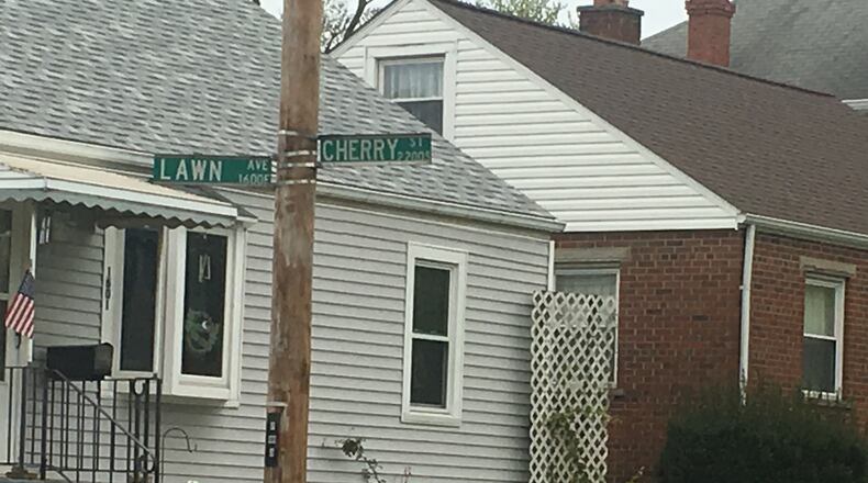 A man and his dog were injured during an incident with another dog today at the corner of Lawn Avenue and Cherry Street, according to Middletown officials. RICK McCRABB/STAFF