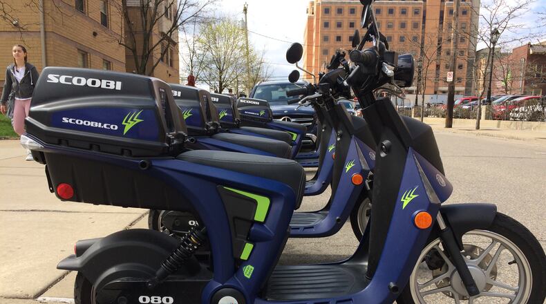 Electric scooters are showing up in cities across the country, including Cleveland, Columbus, Cincinnati and Pittsburgh, Pa. A company called Scoobi has placed 100 scooters in Pittsburgh that anyone 18 or older with a valid driver’s license can rent on-demand. Other scooter rental companies offer devices that do not necessarily require a driver’s license, depending on the city’s laws. LAWRENCE FROLIK / CONTRIBUTED