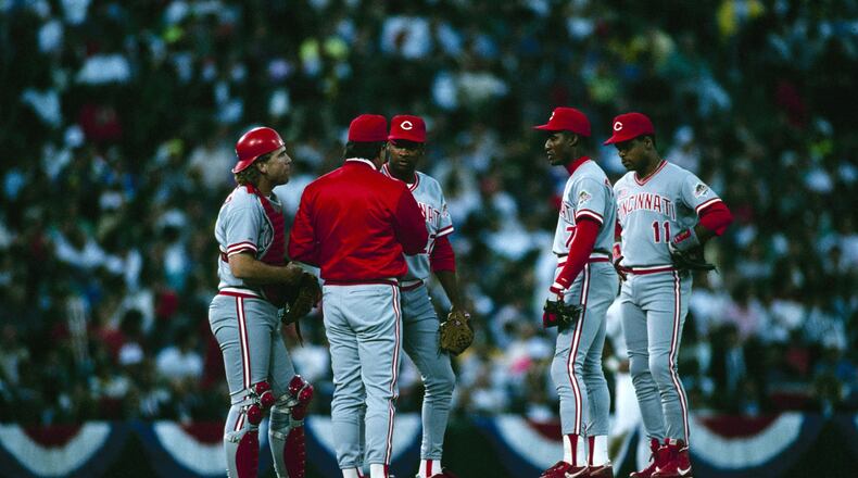 OAKLAND, CA - OCTOBER 20: (L-R) Catcher Joe Oliver #9, Manager Lou Piniella, pitcher Jose Rijo #27, Mariano Duncan #7 and Barry Larkin #11 of the Cincinnati Reds confer on the mound during Game Four of the 1990 World Series against the Oakland Athletics on October 20, 1990 at Oakland Alameda Coliseum in Oakland, California. The Reds defeated the Athletics 7-2 to win the World Series 4-0. (Photo by Otto Greule Jr./Getty Images)