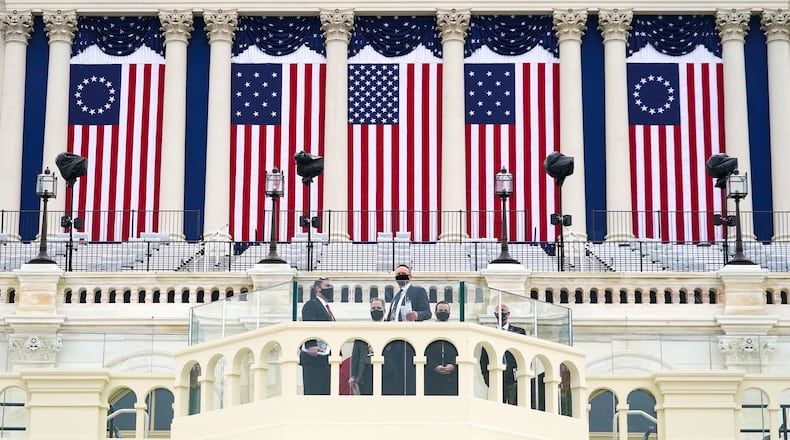 U.S. Secret Service officers check the inauguration stage at the U.S. Capitol in Washington on Friday, Jan. 15, 2021. Law enforcement officials are bracing for more unrest in the days leading up to the inauguration.