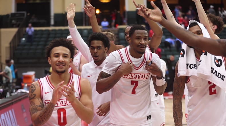 Dayton players leave the court after a victory against Georgetown on Thursday, Nov. 27, 2025, at the State Farm Field House in Kissimmee, Fla. David Jablonski/Staff
