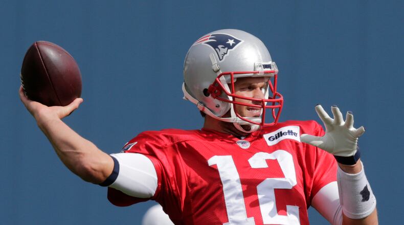 New England Patriots quarterback Tom Brady (12) throws during an NFL football practice in Foxborough, Mass., Wednesday, Oct. 14, 2015. The Patriots face the Indianapolis Colts on Sunday. (AP Photo/Charles Krupa)