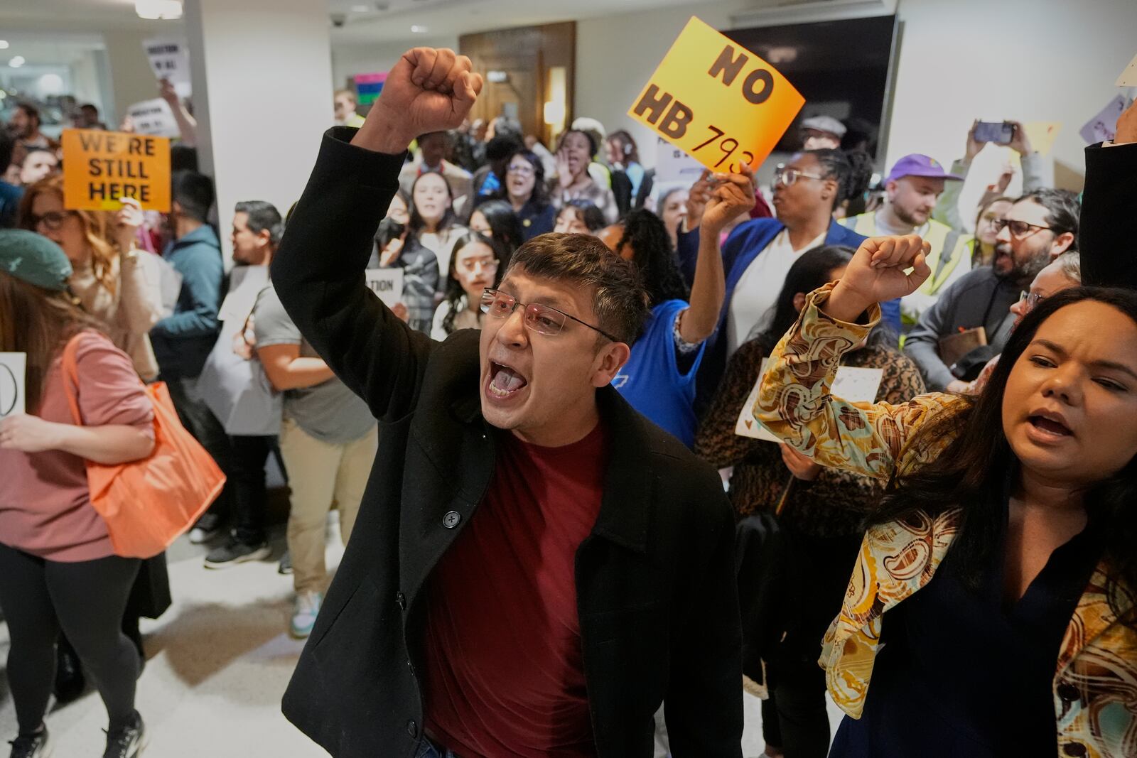 FILE - Dennis Ramos, center, leads a protest outside a House hearing room against a bill that would allow public and charter schools to deny immigrant students from enrolling in classes in Nashville, Tenn., March 11, 2025. (AP Photo/George Walker IV)