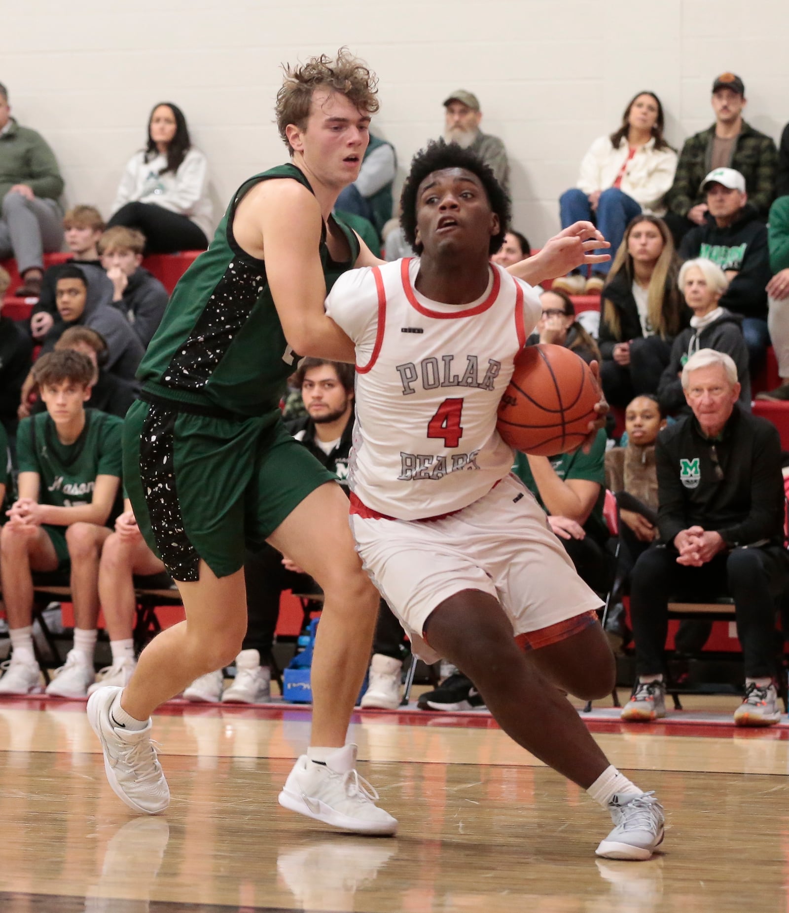 Northridge sophomore D'marriante Crane tries to drive past a defender as his team defeated Mason 52-43 in a non-league game Tuesday, Dec. 22, 2025, in Dayton. STEVEN WRIGHT / STAFF