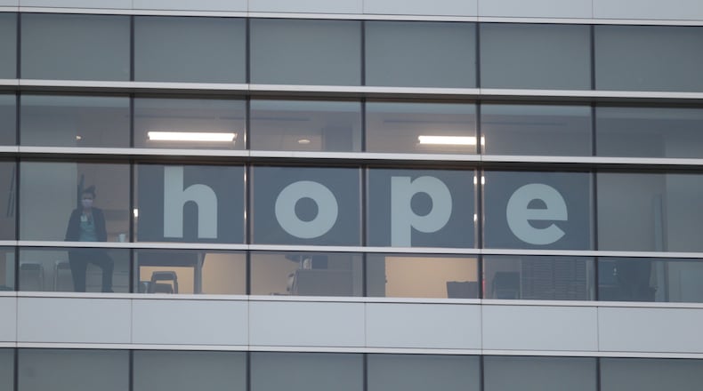 File - First responders flashed "Goodnight Lights" for Dayton Children’s Hospital patients on July 9, 2020. While the tradition began in September 2018, it took on a special meaning during the COVID-19 pandemic as measures to limit the spread of infection meant few visitors for the young patients beyond a parent or legal guardian. JIM NOELKER/STAFF
