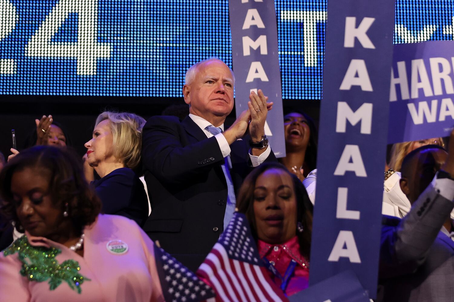 
                        Gov. Tim Walz of Minnesota, the Democratic vice presidential nominee, applauds as Vice President Kamala Harris, the Democratic presidential nominee, speaks on the fourth day of the Democratic National Convention at the United Center in Chicago, on Thursday, Aug. 22, 2024. (Maddie McGarvey/The New York Times)
                      