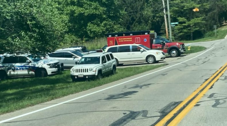 Emergency vehicles can be seen parked off of Wilmington Dayton Pike near East Centerville Station Road.