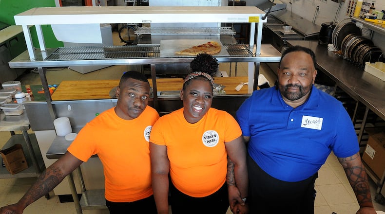 Story's Pizza & Smoothies is a family-owned business located at 2741 West Alex Bell Road in Moraine. The Smith family from left, Cory, Ona, and their father, Steve, enjoy running the business. MARSHALL GORBY\STAFF