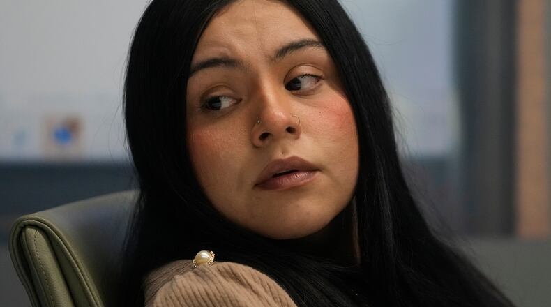 Marimar Martinez, a woman who was shot by a Border Patrol agent last year, sits with her attorneys during a press conference Wednesday, Feb. 11, 2026, in Chicago. (AP Photo/Erin Hooley)