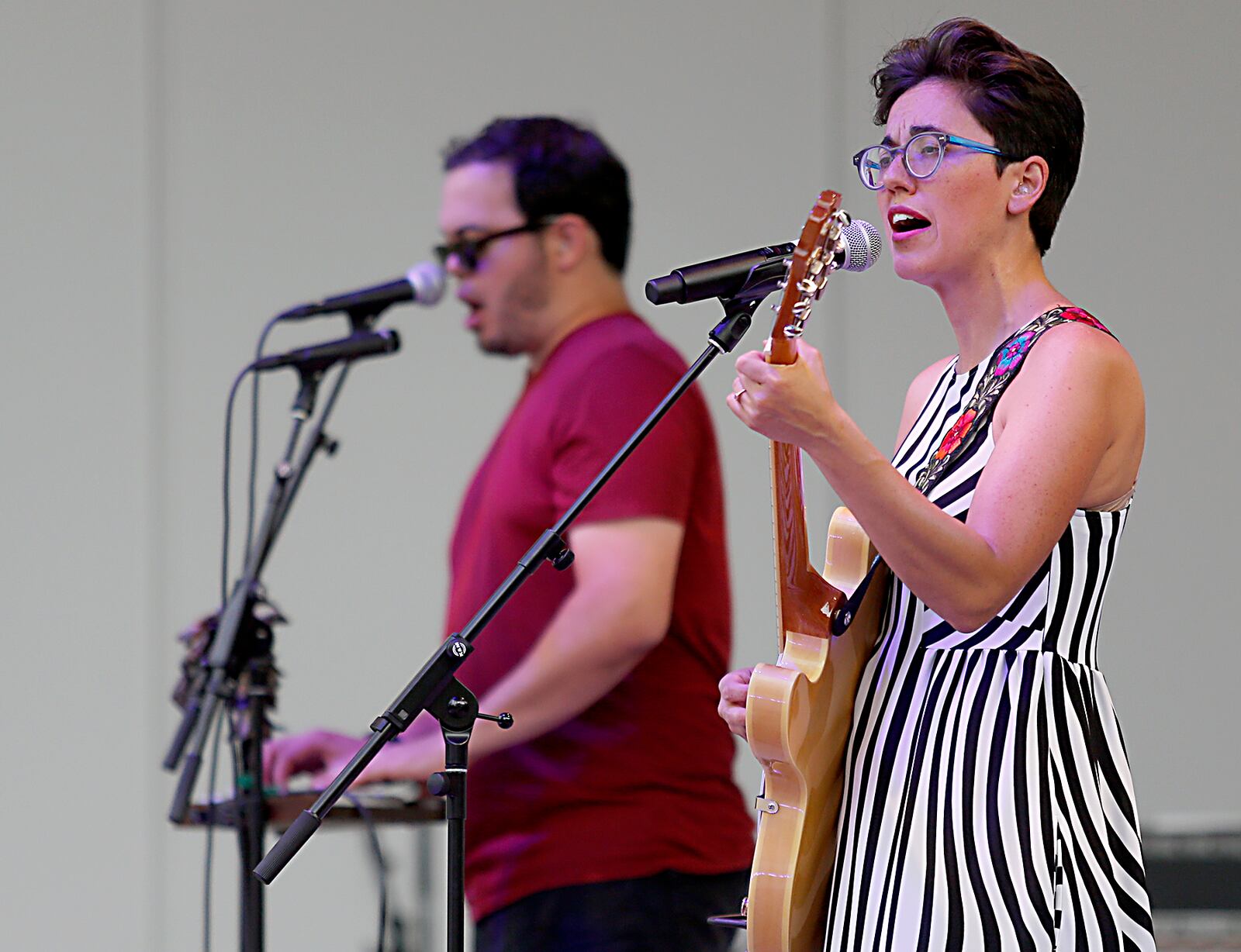 Texas-based singer Gina Chavez performs at the Levitt Pavilion in a dress she bought from Clash in Dayton.