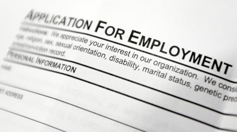 This April 22, 2014, file photo shows an employment application form on a table at a job fair in Hudson, N.Y. Middle-age white Americans with limited education are increasingly dying younger, on average, than other middle-age U.S. adults, a trend driven by their dwindling economic opportunities, research by two Princeton University economists has found. The economists, Anne Case and Angus Deaton, argue in a paper released Thursday, March 23, 2017, that the loss of steady middle-income jobs for those with high school degrees or less has triggered broad problems for this group. (AP Photo/Mike Groll, File)