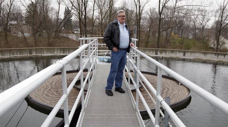 Terry Morris, Veolia Water’s project manager for the Springboro waste water treatment plant, looks out over the clarifier tanks that are part of the upgraded facility in 2011. Morris continues to work at Springboro utility plants.