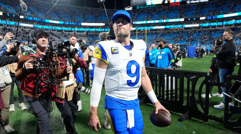 Los Angeles Rams quarterback Matthew Stafford (9) walks off the field after a win over the Carolina Panthers in an NFL wild-card playoff football game, Saturday, Jan. 10, 2026, in Charlotte, N.C. (AP Photo/Erik Verduzco)