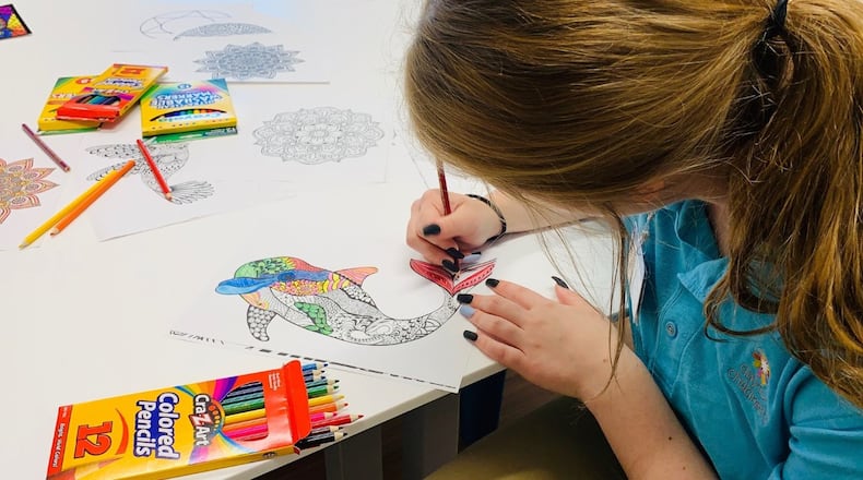 Teen volunteers show off the recreation spaces inside the new behavioral health unit at Dayton Children’s Hospital during a grand opening celebration Wednesday, June 26, 2019. EDWARD KESSLER/STAFF