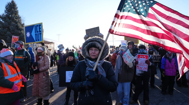 People gather for a protest against ICE outside the Bishop Henry Whipple Federal Building, Friday, Jan. 30, 2026, in Minneapolis. (AP Photo/Adam Gray)