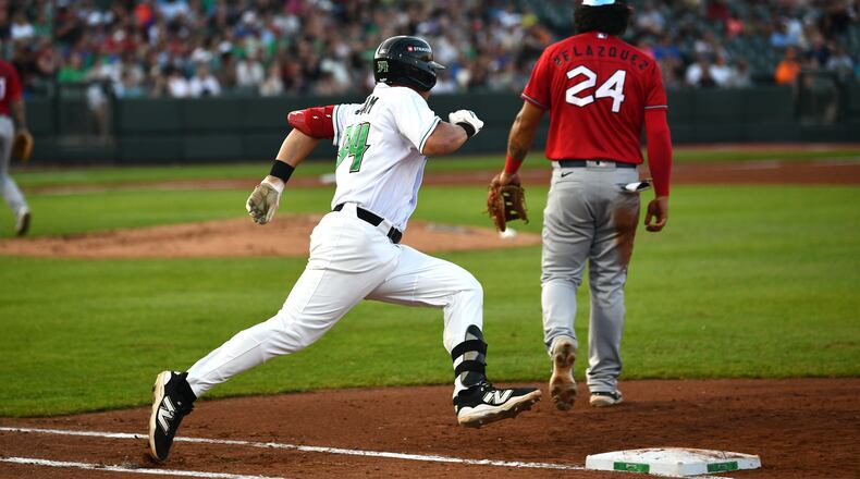 Carter Graham rounds first on a double that helped lead to the Dragons' first run in the fourth inning Saturday night at Day Air Ballpark. JEFF GILBERT/CONTRIBUTED