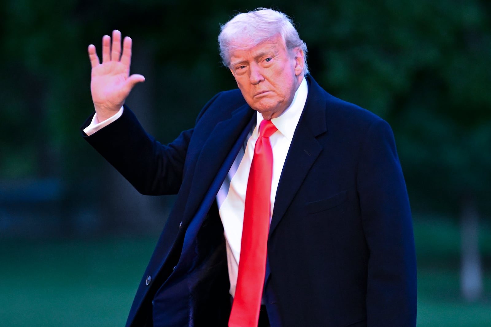 President Donald Trump arrives on the South Lawn of the White House, Thursday, May 22, 2025, in Washington, after attending a crypto dinner at Trump National Golf Club Washington DC. (AP Photo/John McDonnell)