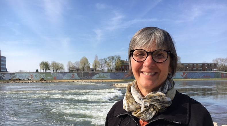 Carrie Scarff, chief of planning and projects for Five Rivers Metroparks, says the Montgomery County Land Bank helped the metroparks system secure a grant to plan development of Wolf Creek and the Great Miami River. Scarff is seen here at the soon-to-be opened River Run feature near RiverScape. THOMAS GNAU/STAFF