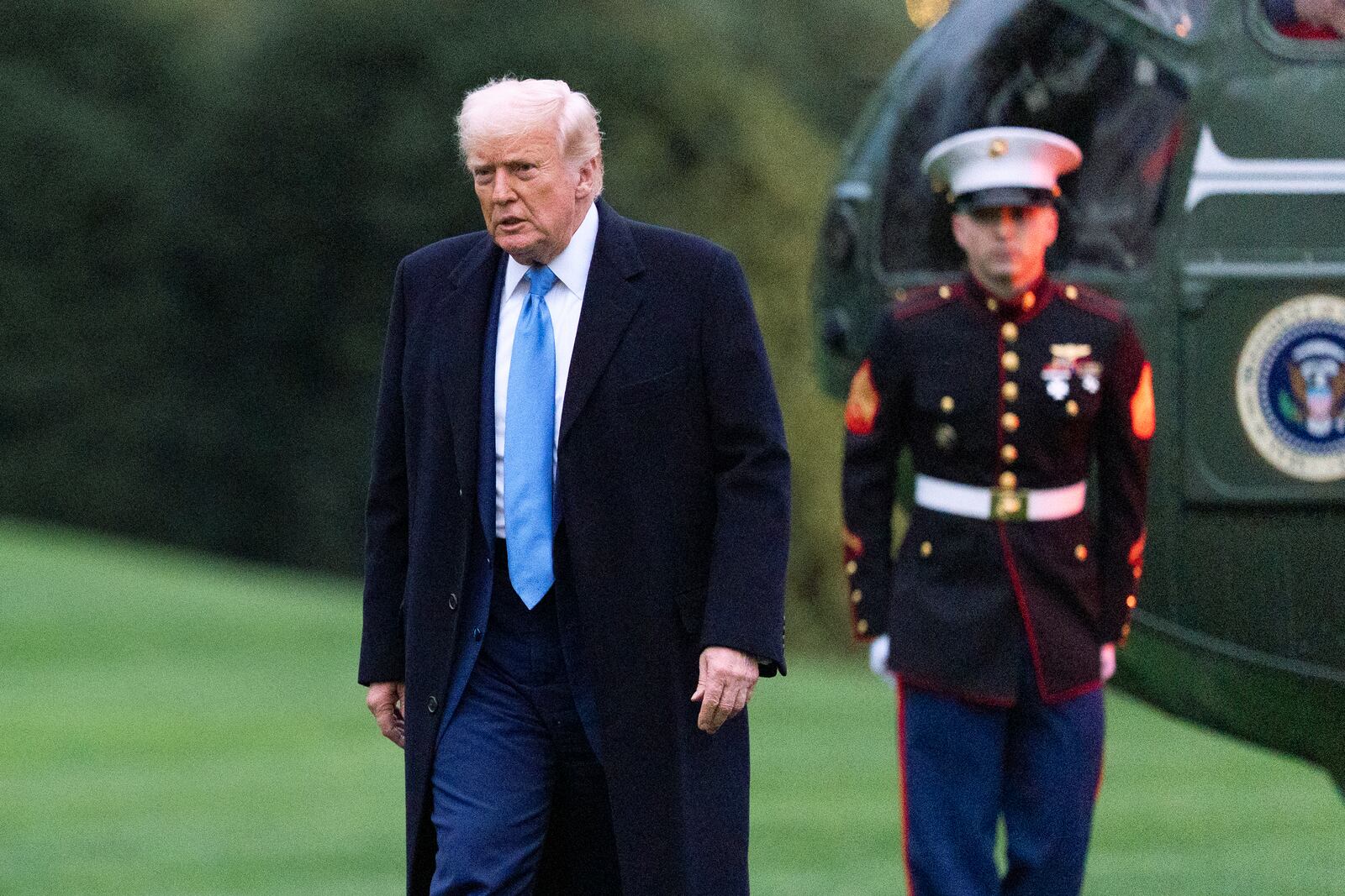 President Donald Trump walks on the South Lawn as he arrives at the White House on Marine One, Sunday, April 6, 2025, in Washington. (AP Photo/Manuel Balce Ceneta)