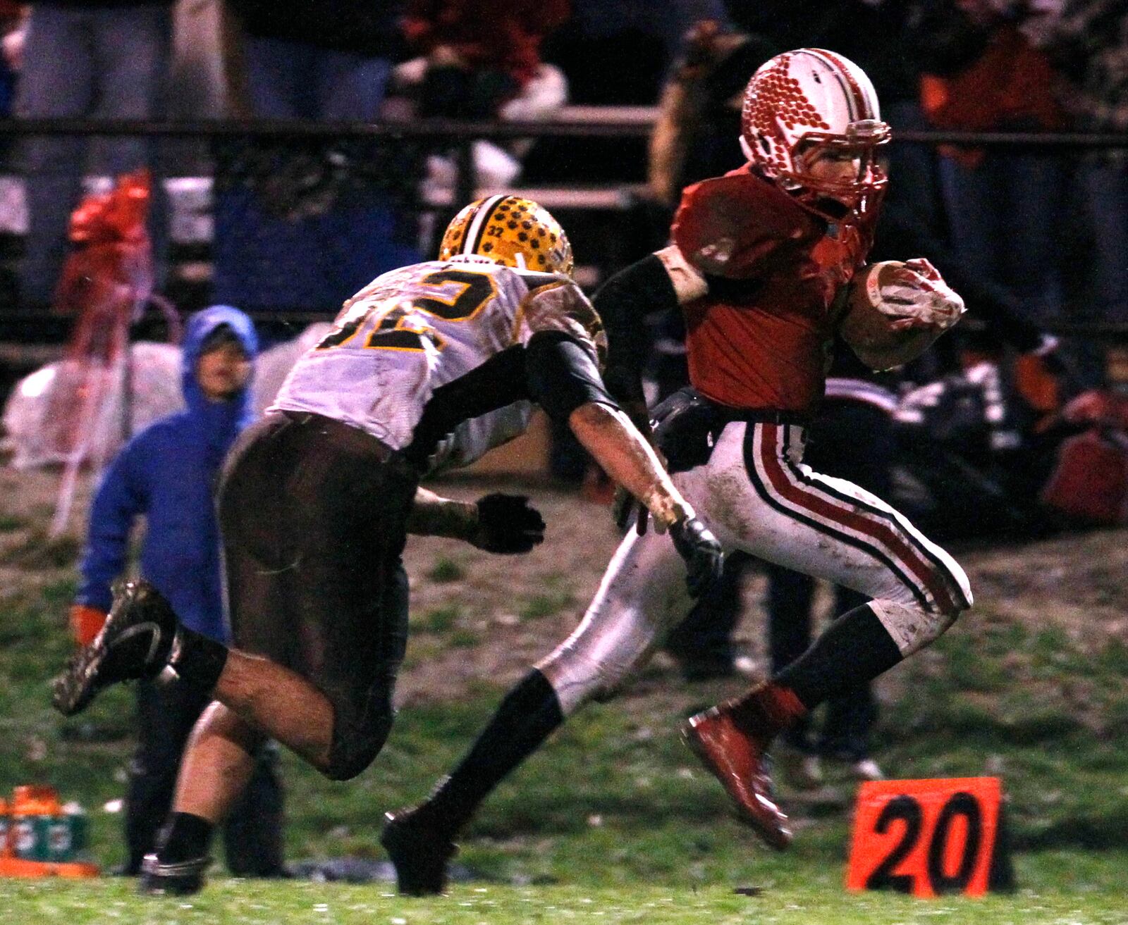 Tippecanoe High School's Jakob Prall heads to the end zone while defended by Kenton Ridge High School's Christian Smith Friday night in Tipp City. LISA POWELL / STAFF