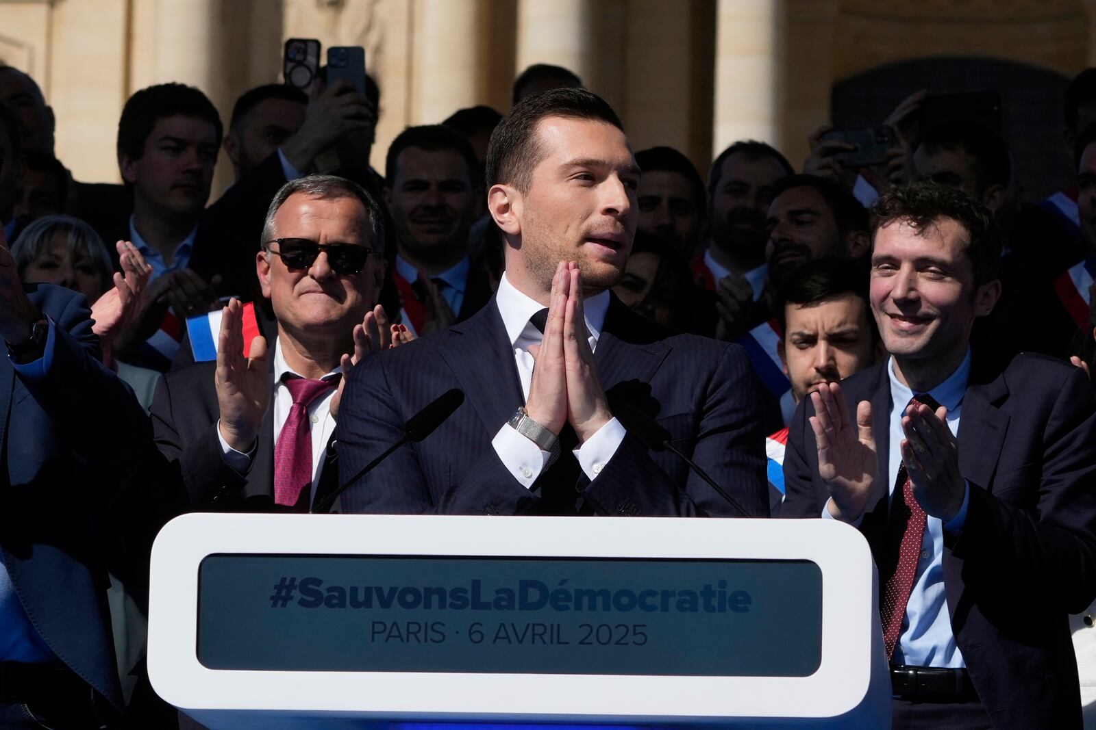 The leader of France's National Rally (RN) Jordan Bardella attends at the French far-right party national rally near the parliament in support of Marine Le Pen in Paris, Sunday, April 6, 2025. (AP Photo/Michel Euler)