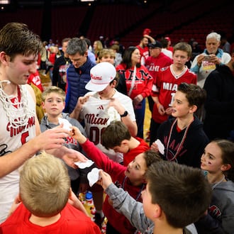 Miami University's Peter Suder signs autographs for fans after the RedHawks beat Toledo 74-72 in Mid-American Conference action on Tuesday, March 3, 2026 at Millett Hall. Miami clinched its first MAC regular season crown since 2005-06. JEREMY MILLER / CONTRIBUTED PHOTO