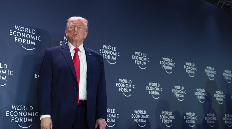President Donald Trump stands on the stage prior to addressing a meeting of Global Business Leaders at the Annual Meeting of the World Economic Forum in Davos, Switzerland, Wednesday, Jan. 21, 2026. (AP Photo/Evan Vucci)