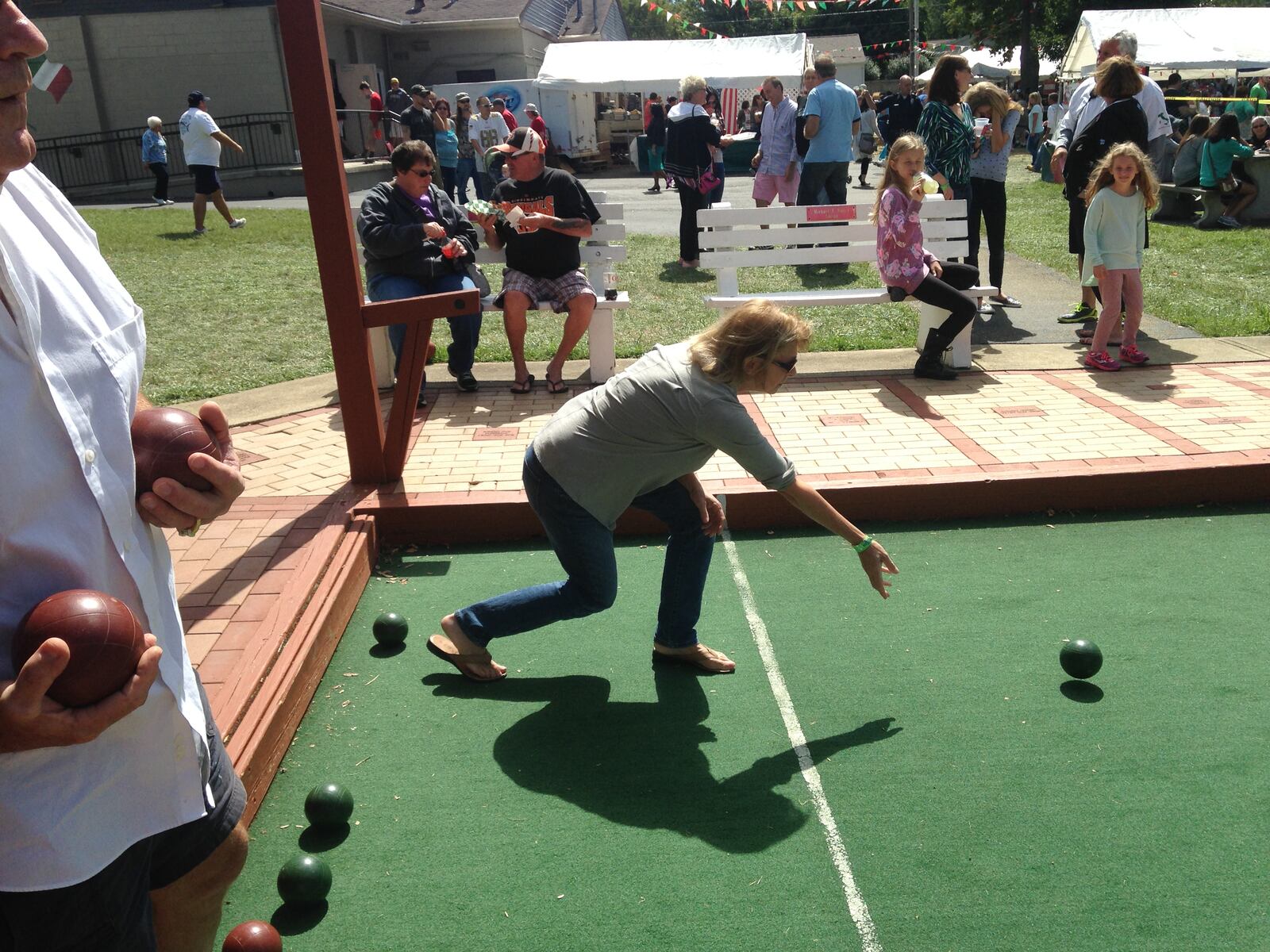 Where you spotted at Sons of Italy's Italian Fall Festa 2015 at Bella Villa Hall. Sunday was game day and many festival-goers wore their Browns and Bengal gear while playing bocce, visiting neighbors, dancing and chowing down on cannoli, spaghetti and meatballs, pizza, Italian beef sandwiches and other grub.  (Staff photo by Amelia Robinson)
