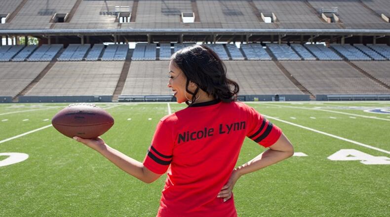 Nicole Lynn runs a "Heels on the Field" blog to teach women about football. (Courtesy of Nicole Lynn/TNS)