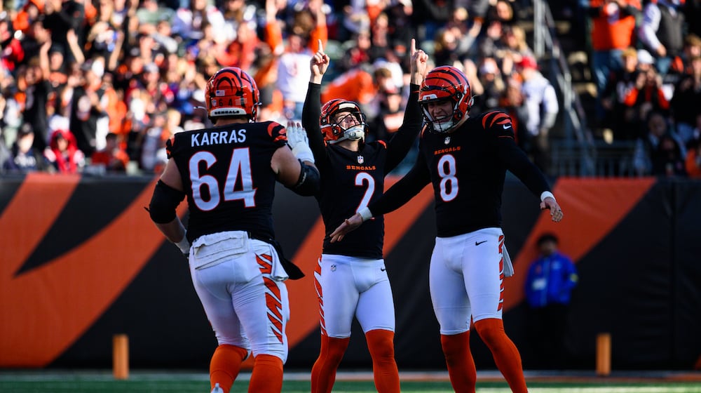 Cincinnati Bengals kicker Evan McPherson celebrates after making a 63-yard field goal at the end of the first half of their game against the New England Patriots on Saturday, Nov. 23, 2025 at Paycor Stadium. JEREMY MILLER / CONTRIBUTED PHOTO