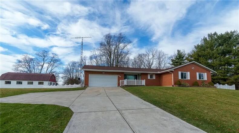 The front of the home has a two-car attached garage with openers and concrete driveway with turnaround. Contributed