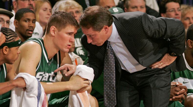 FILE - Michigan State coach Tom Izzo talks to Paul Davis during second half action of their NCAA basketball game against Wisconsin-Green Bay, Dec. 21, 2005, in Green Bay, Wis. Michigan State won 98-69. (AP Photo/Mike Roemer, File)